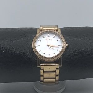 DKNY gold tone quartz ladies watch with pearl face. NY-8121